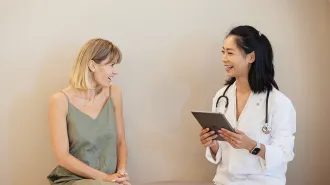 A photo of a woman speaking to her doctor
