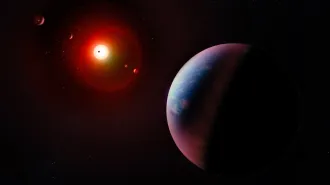 A line of illustrated exoplanets face a star in dark outer space