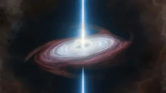 An illustration shows a bright jet of energy blasting from the center of a glowing, tilted disk of gas and dust swirling around a compact star in space.