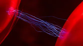 Two red orbs glow as blue lines of electricity zap between them