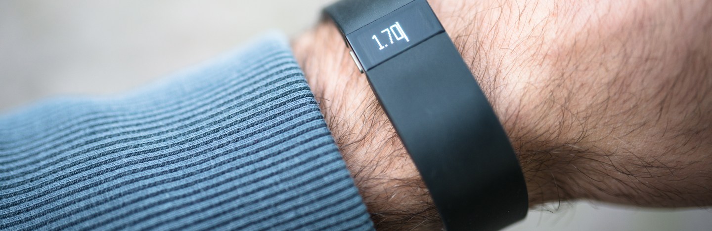 A close-up image of a wrist wearing a Fitbit device