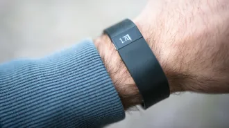 A close-up image of a wrist wearing a Fitbit device