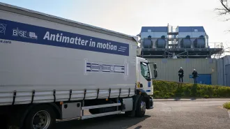 A truck with a banner reading "Antimatter in motion."