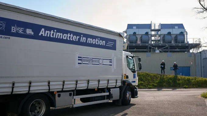 A truck with a banner reading "Antimatter in motion."