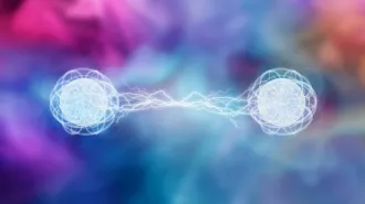 Two spheres on a colorful background connected by jagged lines