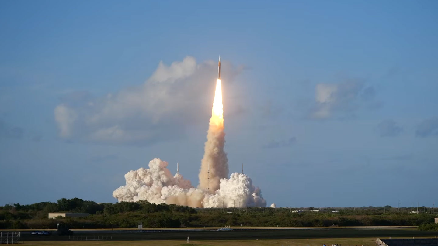 A wide-angle shot of the Artemis II rocket launching against a mostly-clear sky. (via sciencenews.org)