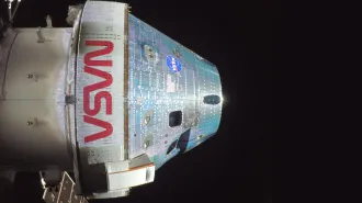 A selfie closeup of the Artemis II Orion capsule on a dark space background