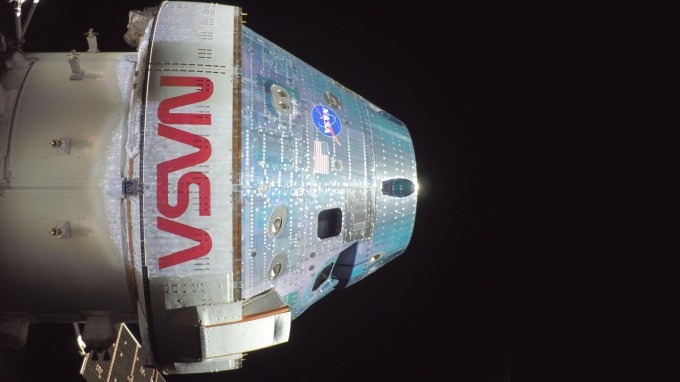 A selfie closeup of the Artemis II Orion capsule on a dark space background