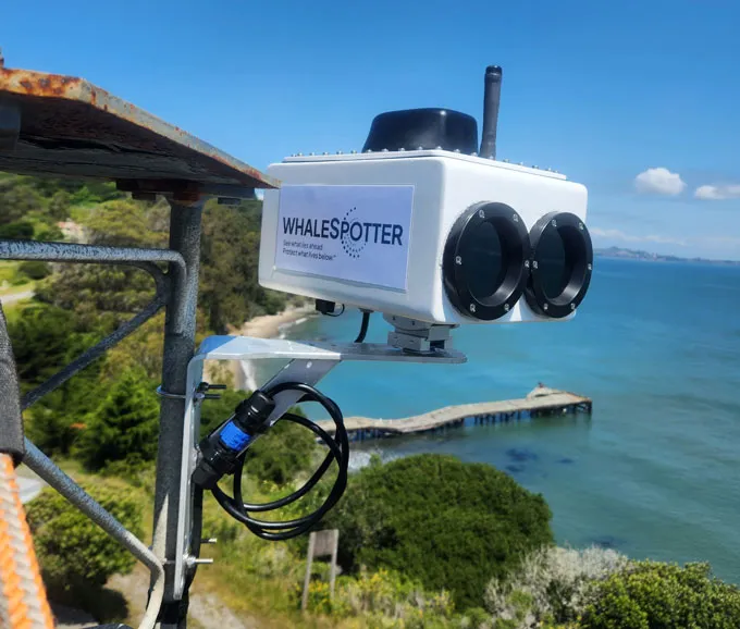 A photograph of a thermal camera mounted on a radio tower in San Francisco Bay, looking for gray whales.