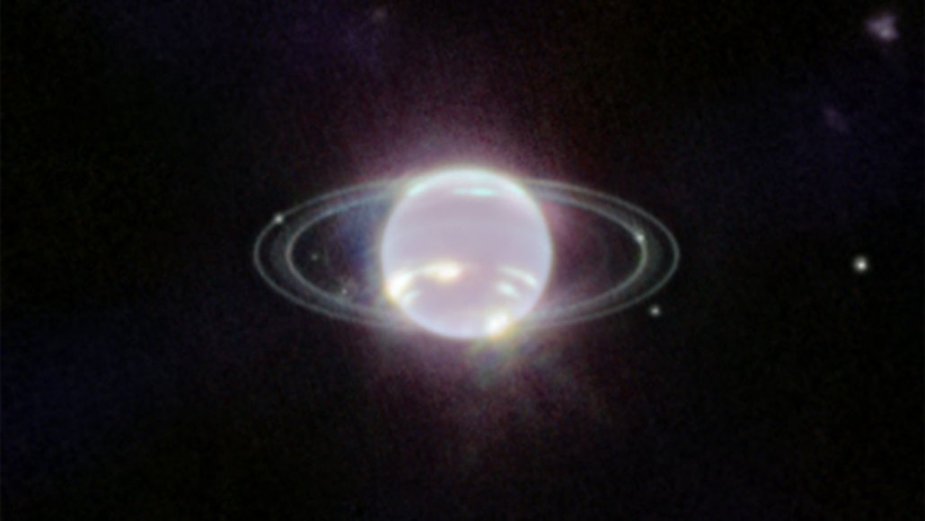 A glowing ringed planet on a black background