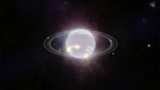 A glowing ringed planet on a black background