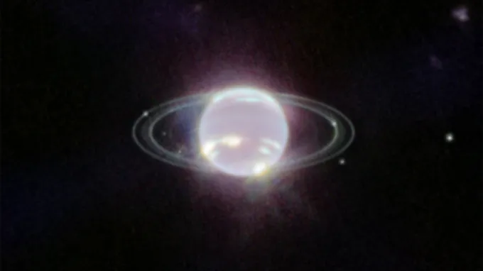 A glowing ringed planet on a black background