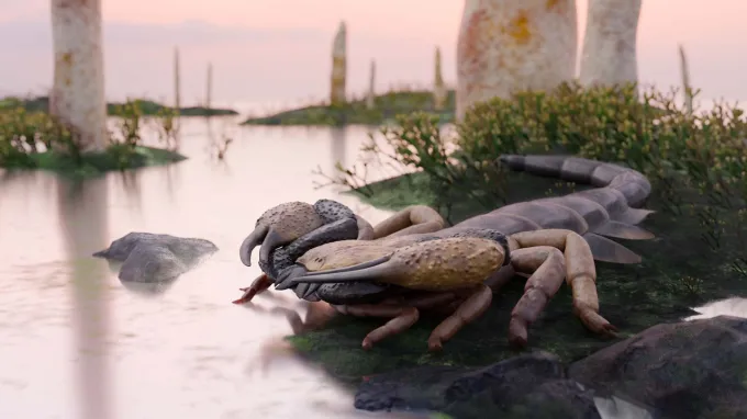 An illustration of a large, prehistoric scorpion with raised pincers and a curled segmented tail, standing on the bank of a river with sparse plants in the background.