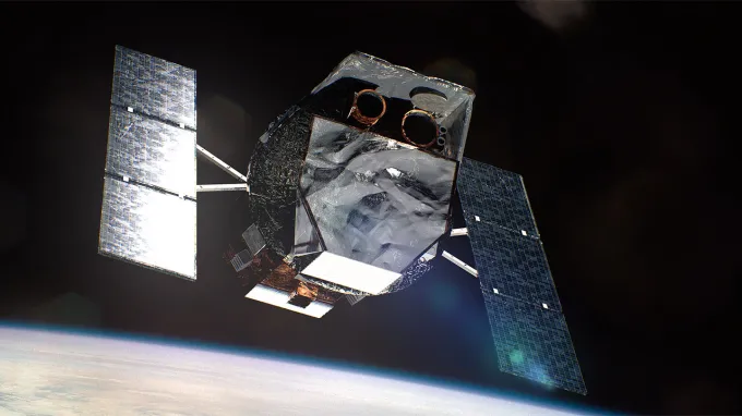 An illustration of a space telescope with extended solar panels with a sliver of Earth in the distance
