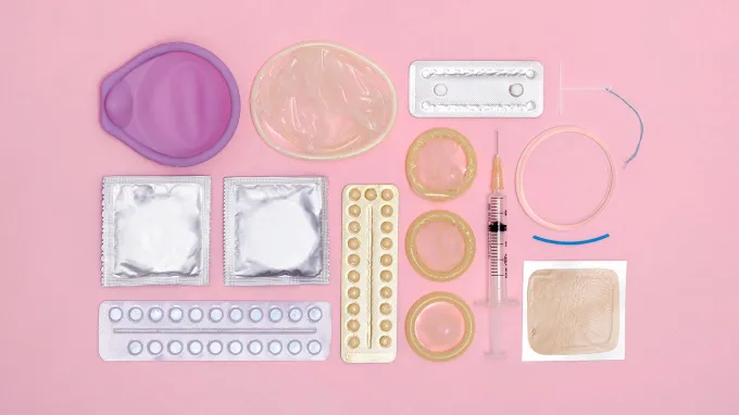 An image featuring different types of birth control, including pills, condoms, a patch, contraceptive shot and more.