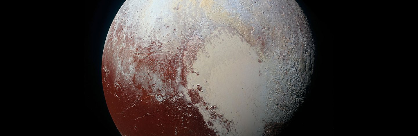 An image of Pluto showing the iconic heart-shaped nitrogen glacier that covers much of its surface.