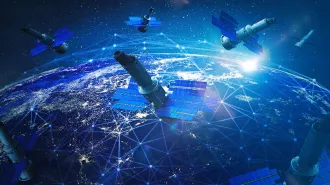 An illustration showing a cluster of satellites orbiting above Earth.