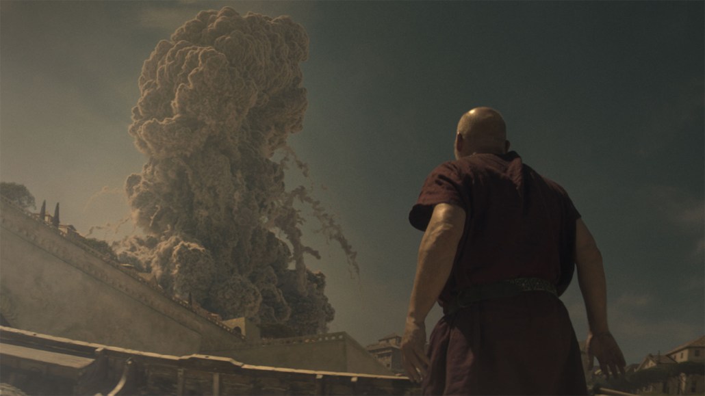 CGI of the historic Mount Vesuvius eruption watched by Barry Aird, dressed as the Praetorian guard in the National Geographic series Pompeii: Out of Time.