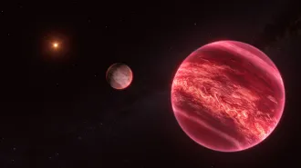 An illustration shows a glowing Jupiter-size object in the foreground, a brown dwarf behind it and a star as a bright point beyond.
