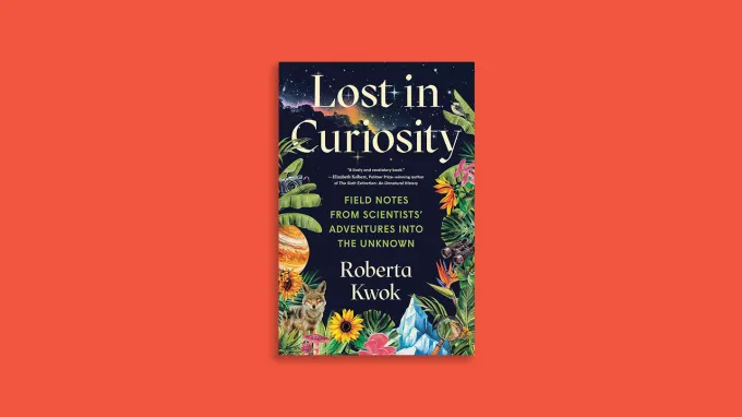The cover of "Lost in Curiosity," a book by Roberta Kwok, on a bright red background. The book's cover features a night sky with stars and a nebula above lush plants, flowers, a wolf, a planet, and scientific objects like binoculars and a camera. The subtitle on the book reads “Field Notes from Scientists’ Adventures into the Unknown.”