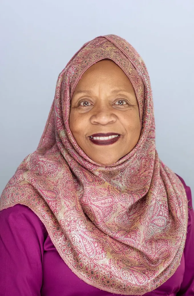 Front-facing photo of biological anthropologist Fatimah Jackson. She has a kind expression and is smiling at the camera.
