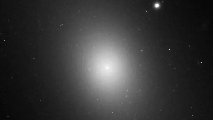 A bright ellipse shines amid the black backdrop of space.